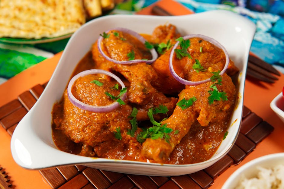 pexels-photo-6113813-6113813 Delicious Pakistani chicken curry with spices and garnished with onion and coriander.